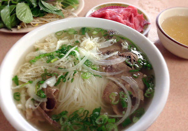 Southern style beef pho with rare beef own the side.